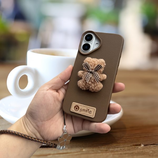 A Single-Pack Plush Teddy Bear Phone Case with a Bow, Available in White And Brown. It Comes with a Wrist Strap And Features a Simple And Elegant Faux Leather Texture That Is Anti-Slip And Fingerprint-Resistant. Made with TPU Full-Wrap Soft Rubber Technology, It Is Suitable for Apple Iphone Models Including XS, Xr, Xsmax, 11, Pro, Max, 12Pro, 13, Promax, 14, 14Pro, 14Promax, 15, 15Pro, 16, 16Pro, And 16Promax. - Image 14