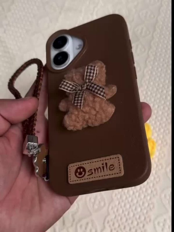 A Single-Pack Plush Teddy Bear Phone Case with a Bow, Available in White And Brown. It Comes with a Wrist Strap And Features a Simple And Elegant Faux Leather Texture That Is Anti-Slip And Fingerprint-Resistant. Made with TPU Full-Wrap Soft Rubber Technology, It Is Suitable for Apple Iphone Models Including XS, Xr, Xsmax, 11, Pro, Max, 12Pro, 13, Promax, 14, 14Pro, 14Promax, 15, 15Pro, 16, 16Pro, And 16Promax. - Image 15