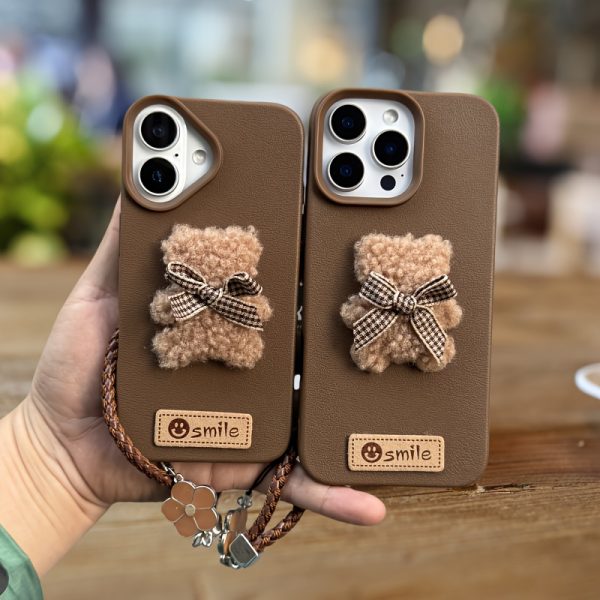 A Single-Pack Plush Teddy Bear Phone Case with a Bow, Available in White And Brown. It Comes with a Wrist Strap And Features a Simple And Elegant Faux Leather Texture That Is Anti-Slip And Fingerprint-Resistant. Made with TPU Full-Wrap Soft Rubber Technology, It Is Suitable for Apple Iphone Models Including XS, Xr, Xsmax, 11, Pro, Max, 12Pro, 13, Promax, 14, 14Pro, 14Promax, 15, 15Pro, 16, 16Pro, And 16Promax. - Image 8