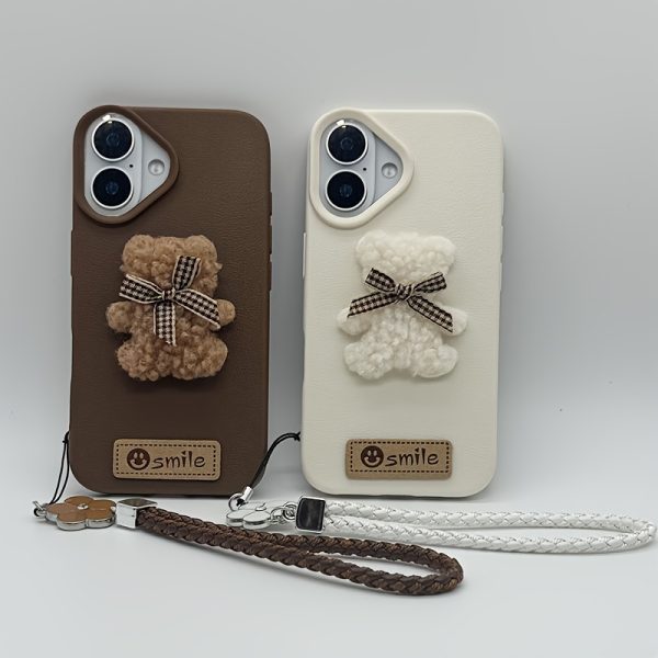 A Single-Pack Plush Teddy Bear Phone Case with a Bow, Available in White And Brown. It Comes with a Wrist Strap And Features a Simple And Elegant Faux Leather Texture That Is Anti-Slip And Fingerprint-Resistant. Made with TPU Full-Wrap Soft Rubber Technology, It Is Suitable for Apple Iphone Models Including XS, Xr, Xsmax, 11, Pro, Max, 12Pro, 13, Promax, 14, 14Pro, 14Promax, 15, 15Pro, 16, 16Pro, And 16Promax.