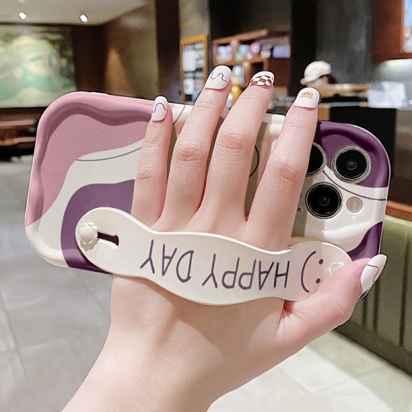 A White And Purple Dual-Tone Smiley Face Phone Case with a Cream Shell And Wrist Support, Featuring a Minimalist Design, Compatible with Models 16/16Plus/16Pro/16Promax/15/15Plus/15Promax/14/14Plus/14Pro/14Promax, 13/13Pro/13Promax, 12/12Pro/12Promax, 11/11Pro Max. - Image 2